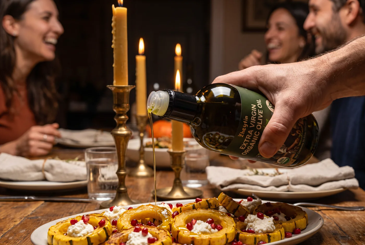 Pouring Zheytin over roasted squash at a fall dinner